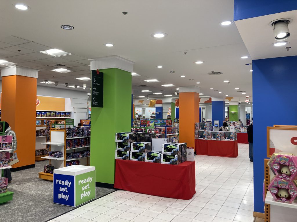 A photo of various shelves, containing different toys.