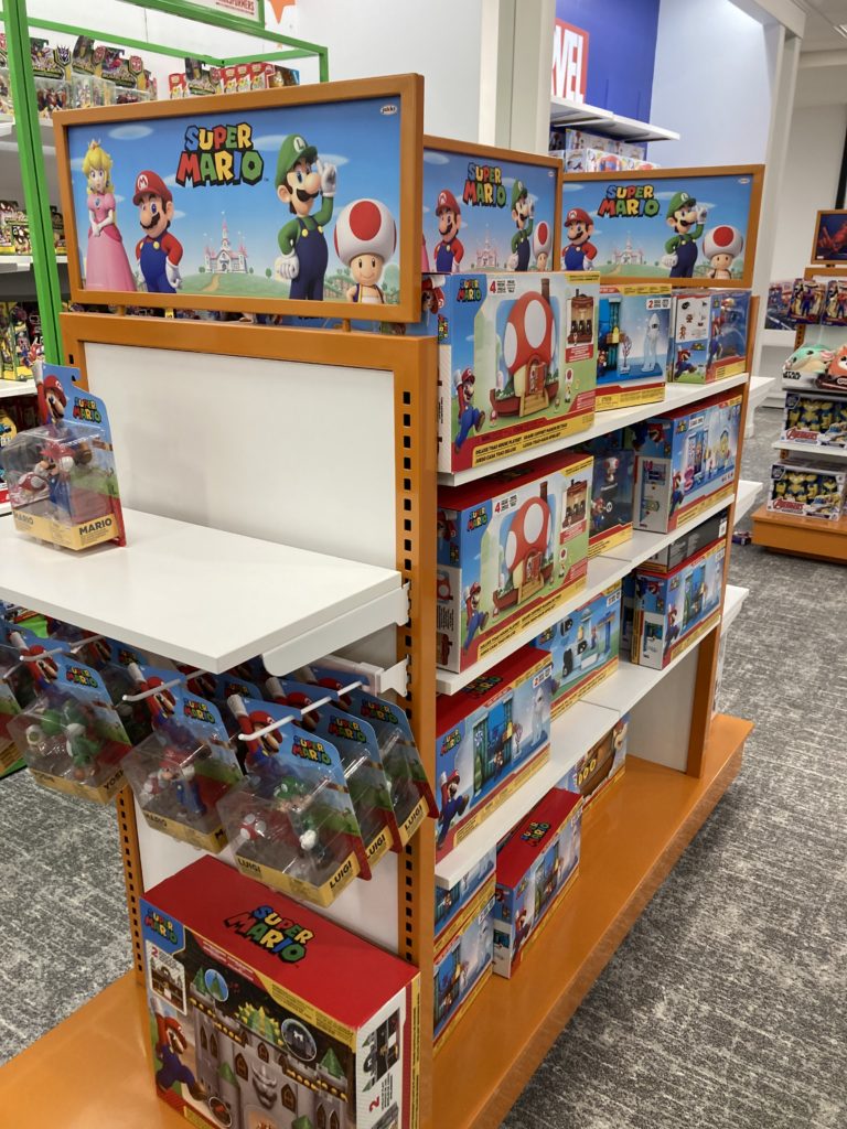 A toy shelf with toys from Super Mario.